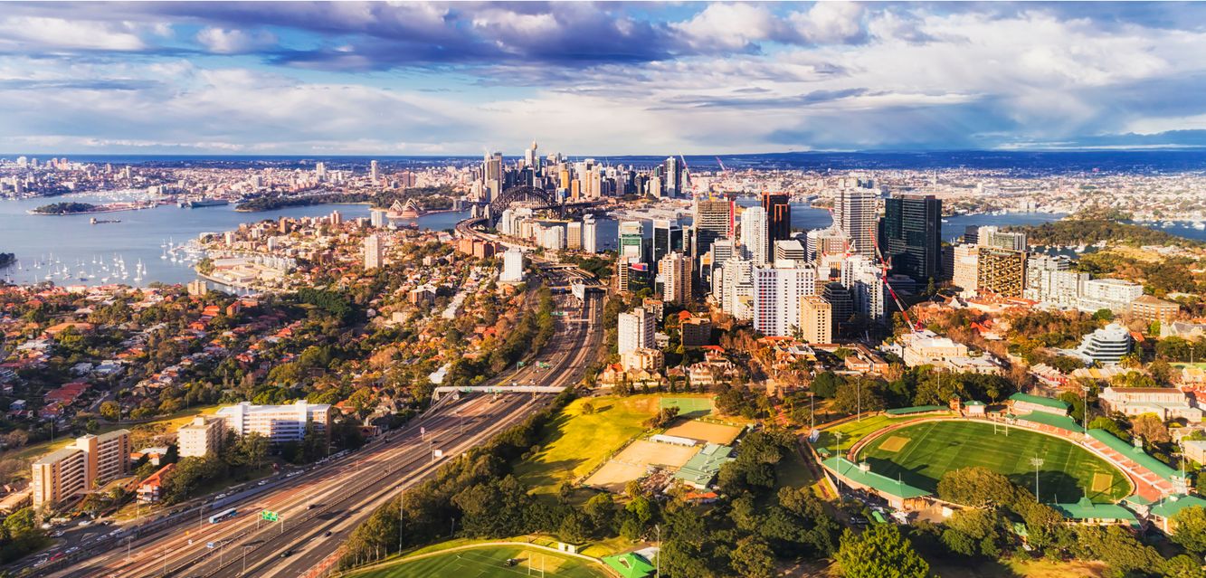 An elevated view of North Sydney with Sydney Harbour beyond.