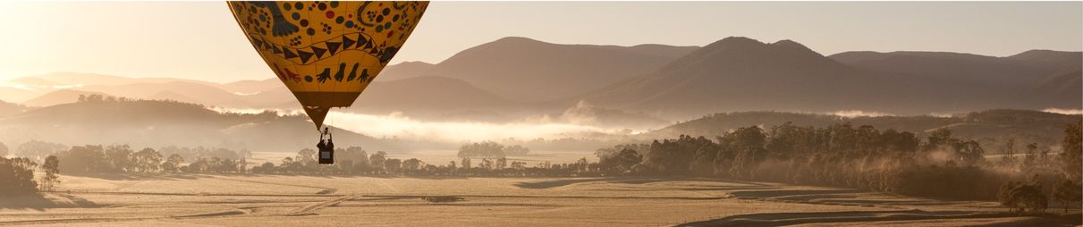 A sunrise hot air balloon flight over the Yarra Valley in Victoria, Australia.