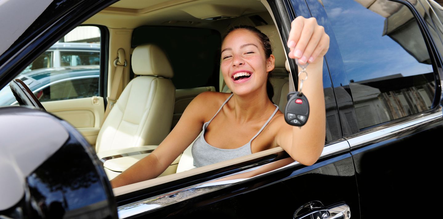 Happy renter picks up their rental SUV.