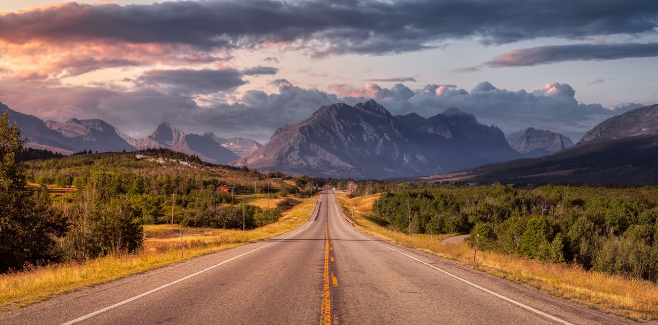 Beautiful View of Scenic Highway with American Rocky Mountain Landscape in the background.