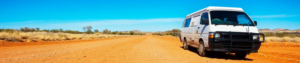 Backpacker van on a desert road.
