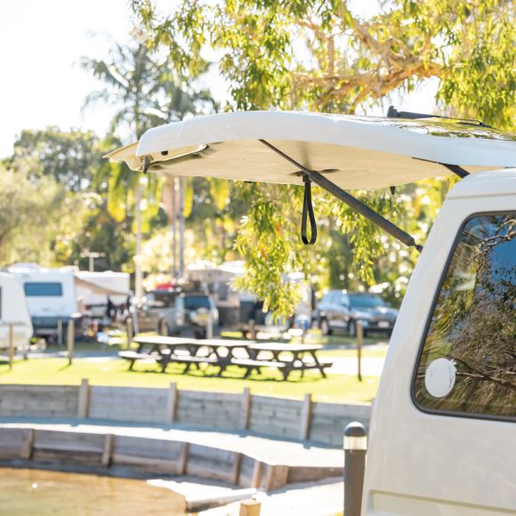 A van parked at a motorhome campground.